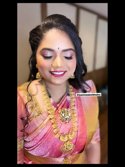 A happy smile from the sister of the bride, with her shimmery eye makeup and pink lips looking perfect.