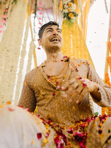 The groom's pure, uninhibited laughter during his Haldi. I believe in capturing these real, unguarded emotions that tell the true story of the day.