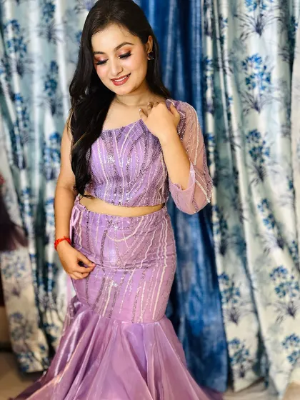 A client trying on a beautiful lavender fishtail gown in my studio. It's always a pleasure to help you find the perfect dress.