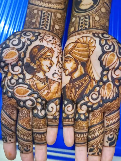 A close-up of the couple's portraits from my cousin's bridal mehendi. The negative space around the figures makes them stand out beautifully.