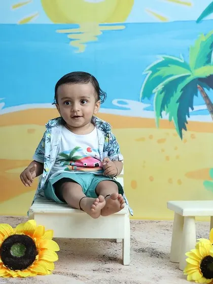 A classic shot from the beach series, showing the full setup with the happy toddler.