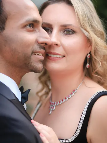 A close-up portrait that highlights the bride-to-be's beautiful smile and jewellery. This shot from their pre-wedding session feels intimate and captures a moment of quiet confidence.