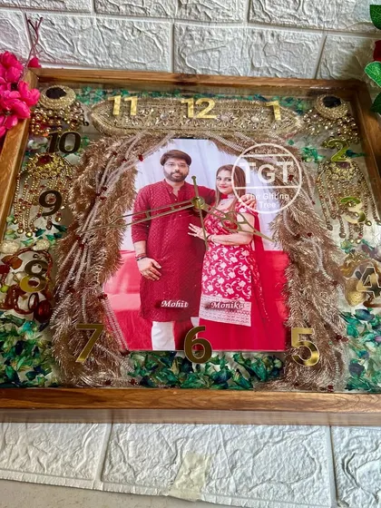 My largest offering, this 18-inch square teakwood clock, preserves not just the varmala but also the groom's sehra and bride's kalire, creating an all-in-one wedding story.