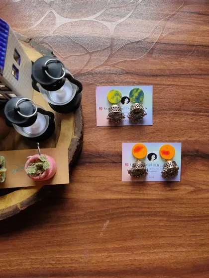 Simple and cute fabric patch studs with jhumki drops. These are available in a variety of hand-painted colors and are a great small accessory for daily traditional wear.