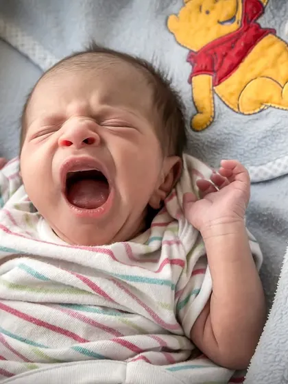 The tiniest yawns hold the biggest dreams. My newborn sessions are simple and cozy, focusing on your baby's natural expressions and delicate features in a comfortable setting.