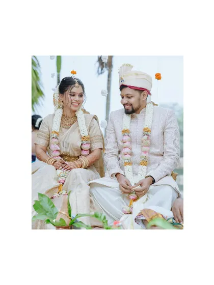 A sweet, candid moment between the couple during their wedding ceremony, their smiles full of love.