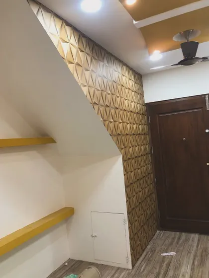 This image shows how I handle tricky installations with 3D wallpaper, cutting it perfectly to fit around a slanted staircase wall.