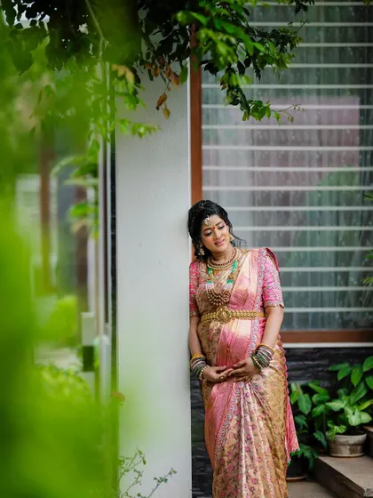 A quiet, contemplative portrait from a maternity shoot. The soft lighting and natural setting create a peaceful and beautiful image.