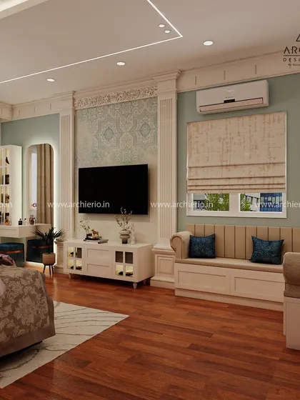 This view shows the TV and dressing area of the luxury bedroom. The design maintains a cohesive look with classic elements and a soothing color palette.
