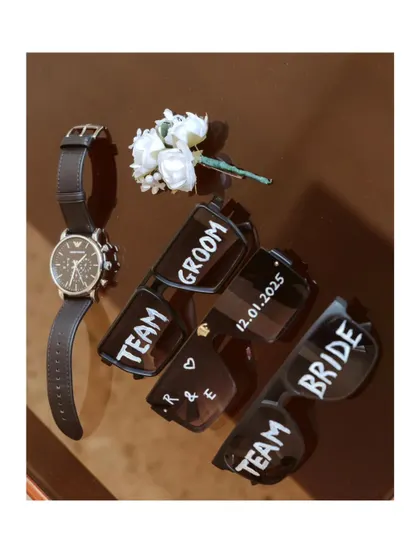 The little details that bring the wedding party together. Custom sunglasses for the bride, groom, and their teams add a fun, personal touch for photos before and after the ceremony.