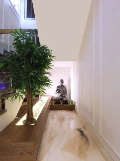 A tranquil Buddha statue is placed at the base of the staircase, welcoming you with a sense of peace and serenity.