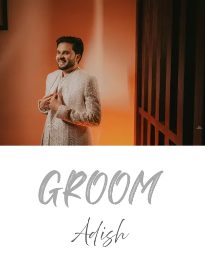 A candid shot of the groom adjusting his sherwani, a small moment of preparation captured with warm, inviting light.