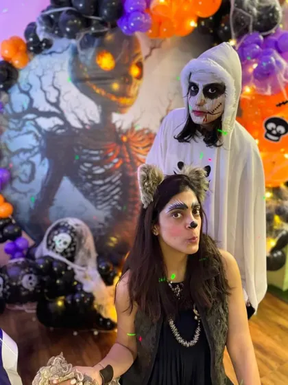 Even the parents get into the Halloween spirit! I love seeing families dress up together and pose at our spooky photo spots. It's all about making memories.