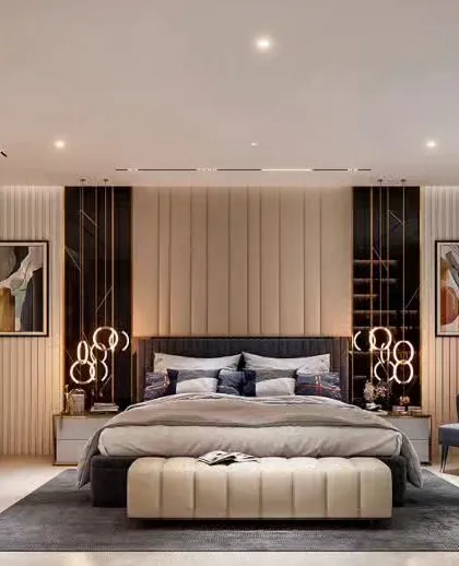 A luxurious bedroom design with a statement headboard, elegant lighting, and a comfortable seating area.