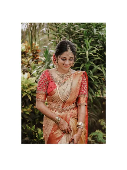 A serene portrait of the bride looking down, her expression calm and beautiful.