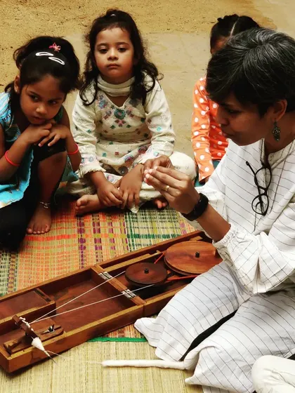 History comes alive through our hands. Here, I am showing the children how to spin thread on a charkha, connecting them to our country's story in a tangible way. Learning is not just about facts and dates; it is about feeling the texture of the past and understanding its place in our present.