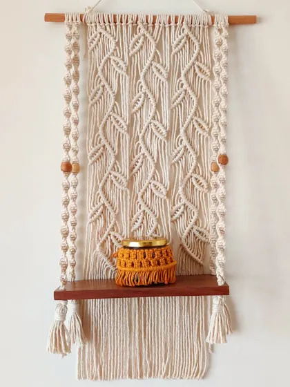 The shelf is sturdy enough to hold decorative items, like this small macrame jar.