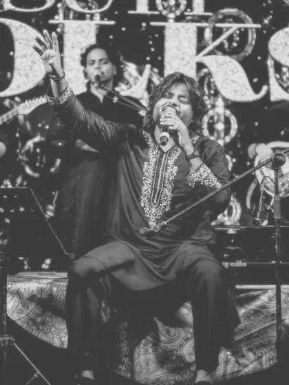 A timeless black and white photo of me singing my heart out. This captures the raw emotion and classic feel of a Sufi performance.