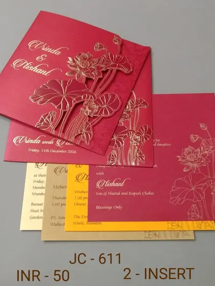 A bold red invitation with a gold embossed lotus design. This card is simple yet striking, perfect for a traditional ceremony, and comes with colorful inserts.