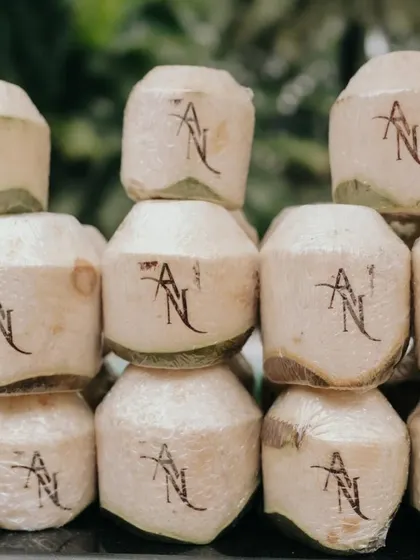 It's the small personal touches that make a wedding unique. For this event, we arranged for custom-monogrammed coconuts to welcome guests, offering a refreshing and memorable start to the Haldi celebrations.