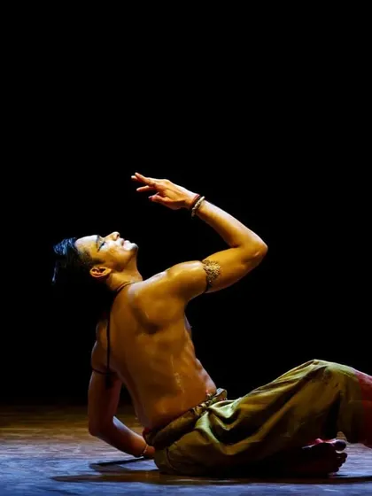 A seated expressive posture from the Pune performance. Not all movements are large; some of the most powerful moments are found in subtlety and control.