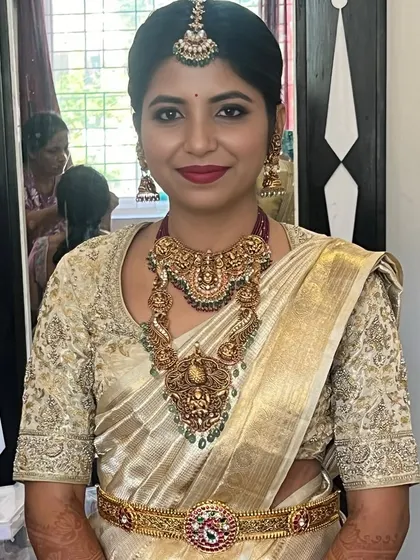 A happy bride ready for her big day. The makeup is polished and perfect, designed to last through a long day of ceremonies while looking fresh and radiant.