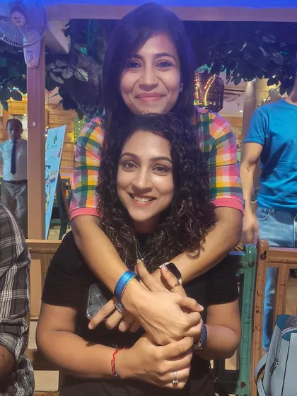 Hugs and smiles with a friend. The support system within our running community is incredible.