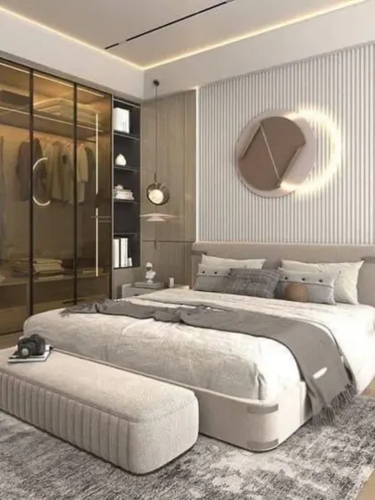 Functionality meets high style in this bedroom, which features a seamless glass-paneled walk-in wardrobe. This design element keeps the room feeling open and allows for an organized display of clothing.