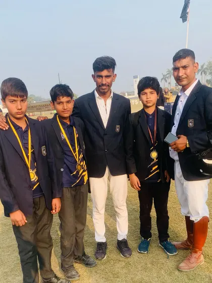 Instructors with young medal-winning students. We celebrate every achievement and are dedicated to helping our riders reach their full potential.