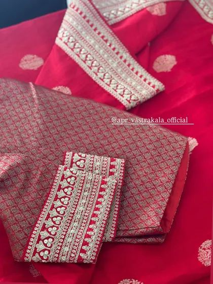 A close-up of the red brocade blouse.