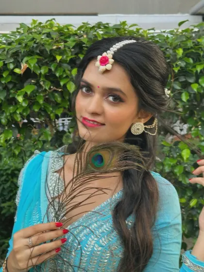 Another portrait with the peacock feather, connecting the artistic expression with its cultural and spiritual roots.