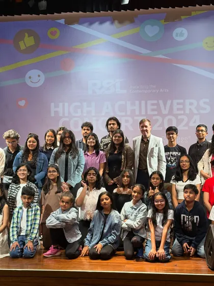A group photo with the entire team and performers at the RSL High Achievers Concert. Being part of this larger community of talented artists is an inspiring experience for our students and instructors.