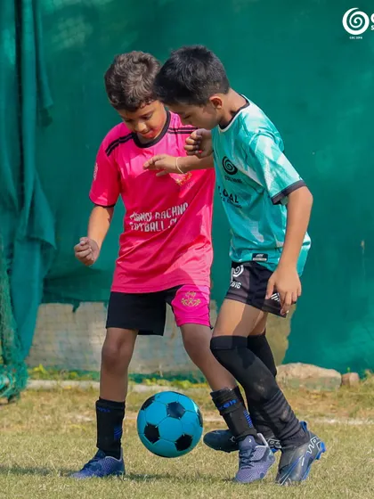 Two of the youngest competitors learning the game and having fun.