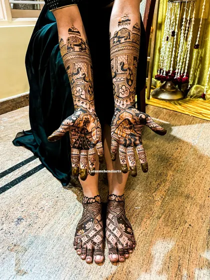 The full bridal look, with intricate Radha-Krishna mehendi on both hands and complementary designs on the feet.