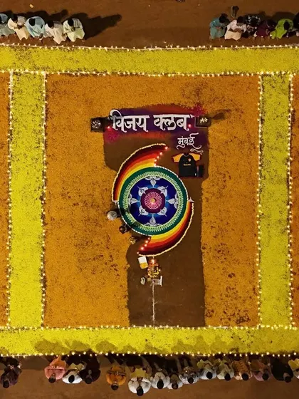 A stunning top-down view of the flower rangoli depicting our club's name.