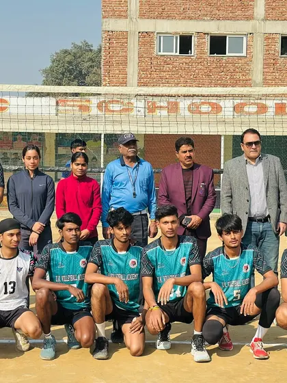 Our boys' team with officials at a tournament. We teach our players sportsmanship and respect for the game, both on and off the court.