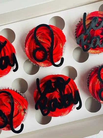 An overhead shot of the Leo cupcakes, capturing the bold red and gold colors that represent the Leo personality.