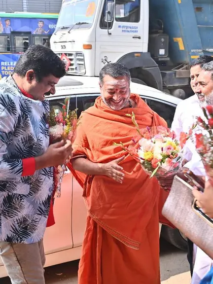 Welcoming a revered Swamiji with flowers. It is always an honour to receive and interact with spiritual leaders.
