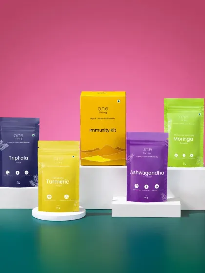 Another composition for the One Living Immunity Kit, using contrasting brand colors and white geometric blocks. This creates a modern, organized, and eye-catching product display.