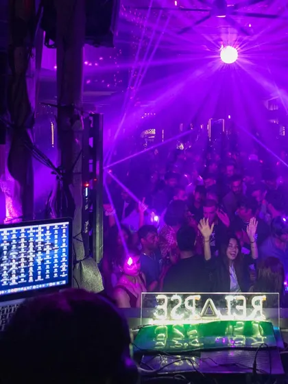 Using lasers to create a cage of light over the dance floor. Advanced lighting effects like these transform a venue and elevate the party experience.