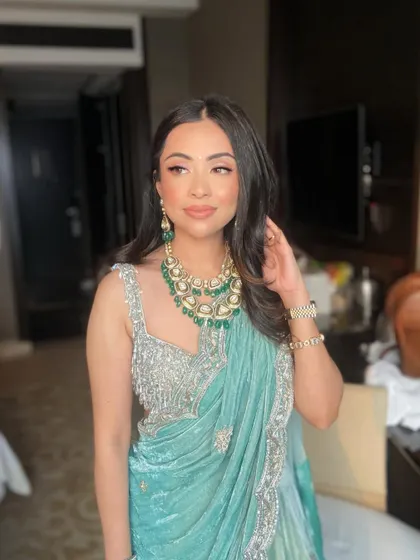 This candid shot shows how the makeup looks beautiful and natural, even in a relaxed pose.