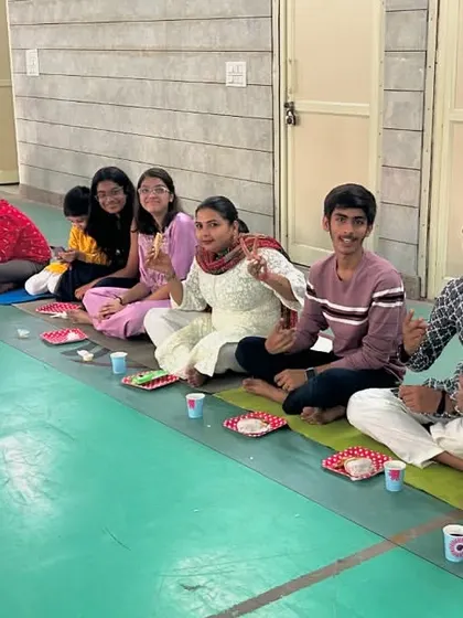 We are more than just a club; we are a fencing family. Here is our team sharing a meal together during our Diwali celebration. We believe in training hard together and supporting each other like family.