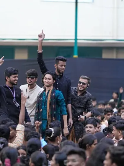A shot from within the crowd, showing students enjoying the college fest atmosphere.