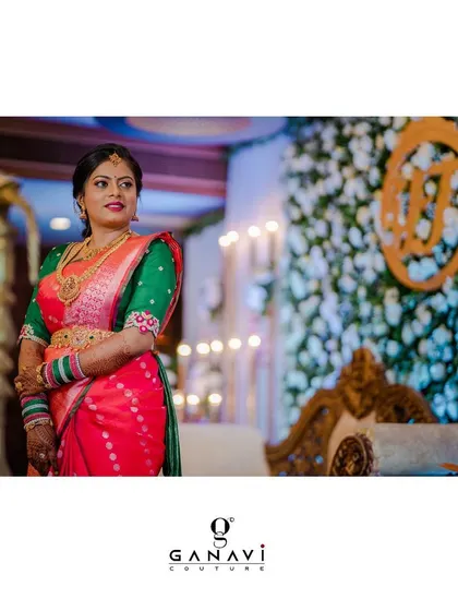 Our gorgeous bride Yamuna in a hand-embroidered green blouse paired with a vibrant pink and green saree. A true beauty whose soul is reflected in her smile.