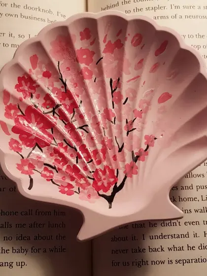 We can't get enough of hand-painting cherry blossoms. This custom-ordered mini shell dish combines a soft pink base with delicate floral art.