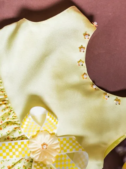 A close-up of the hand-beaded neckline on this lovely yellow dress. These are the small, thoughtful details that make my creations unique.