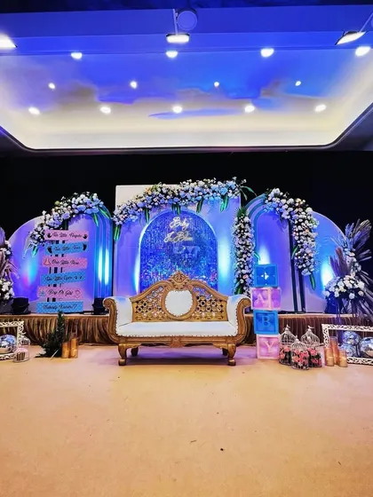 A full stage view of a "Twinkle Twinkle Little Star" themed baby shower. The design includes multiple decorated panels, a regal white and gold throne for the mom-to-be, and sparkling disco balls to catch the dreamy blue and purple lighting.