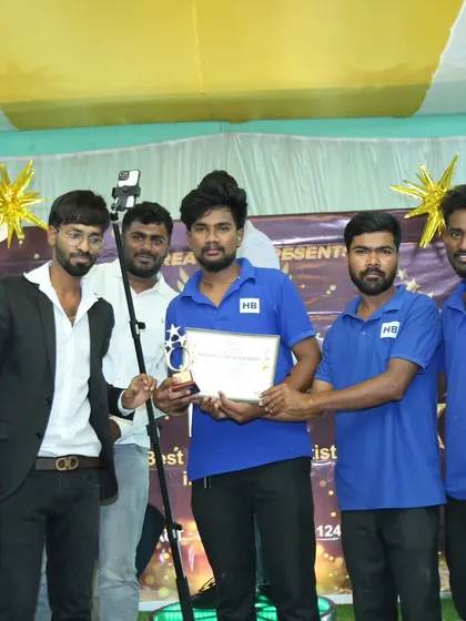 The Hiibangalore Catering team on stage, accepting the award for our dedication to quality and service.