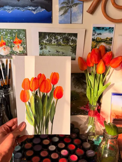 Another view of the finished tulip painting in my studio, surrounded by my brushes and other art supplies. It gives you a feel for the creative space where I work.