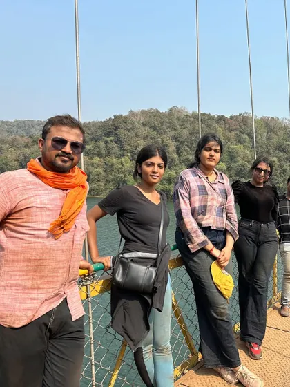 A group photo on a suspension bridge.